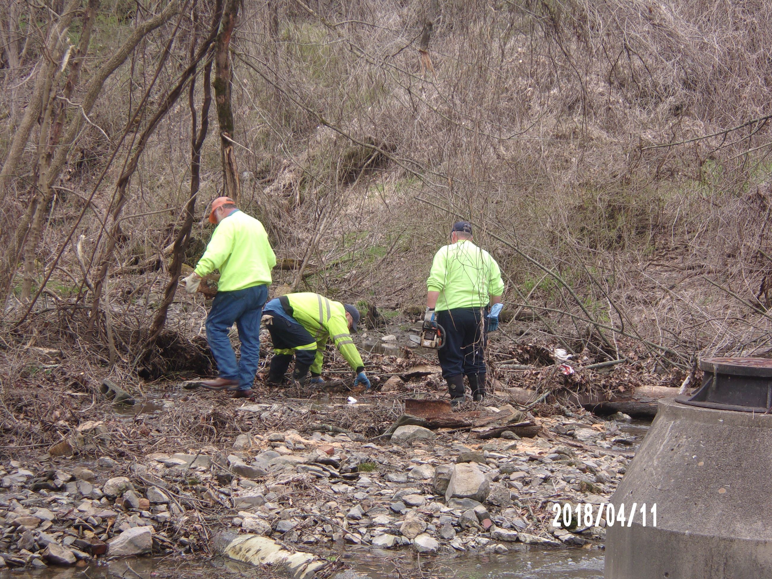 Three Men Clearing Branches