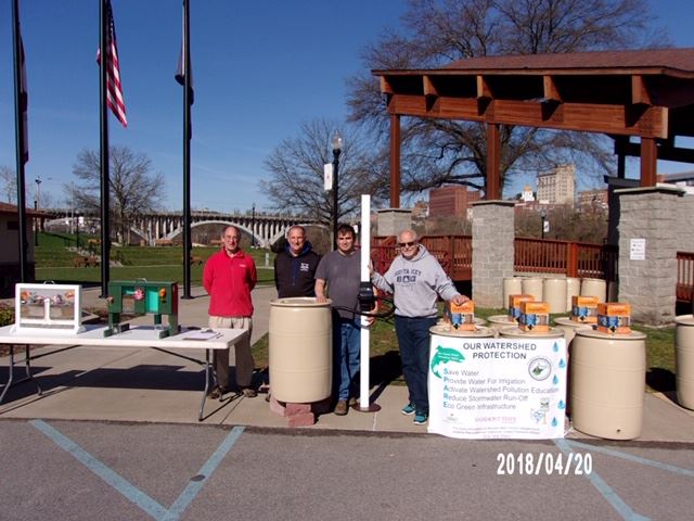 Four People by "Our Watershed Protection" Table