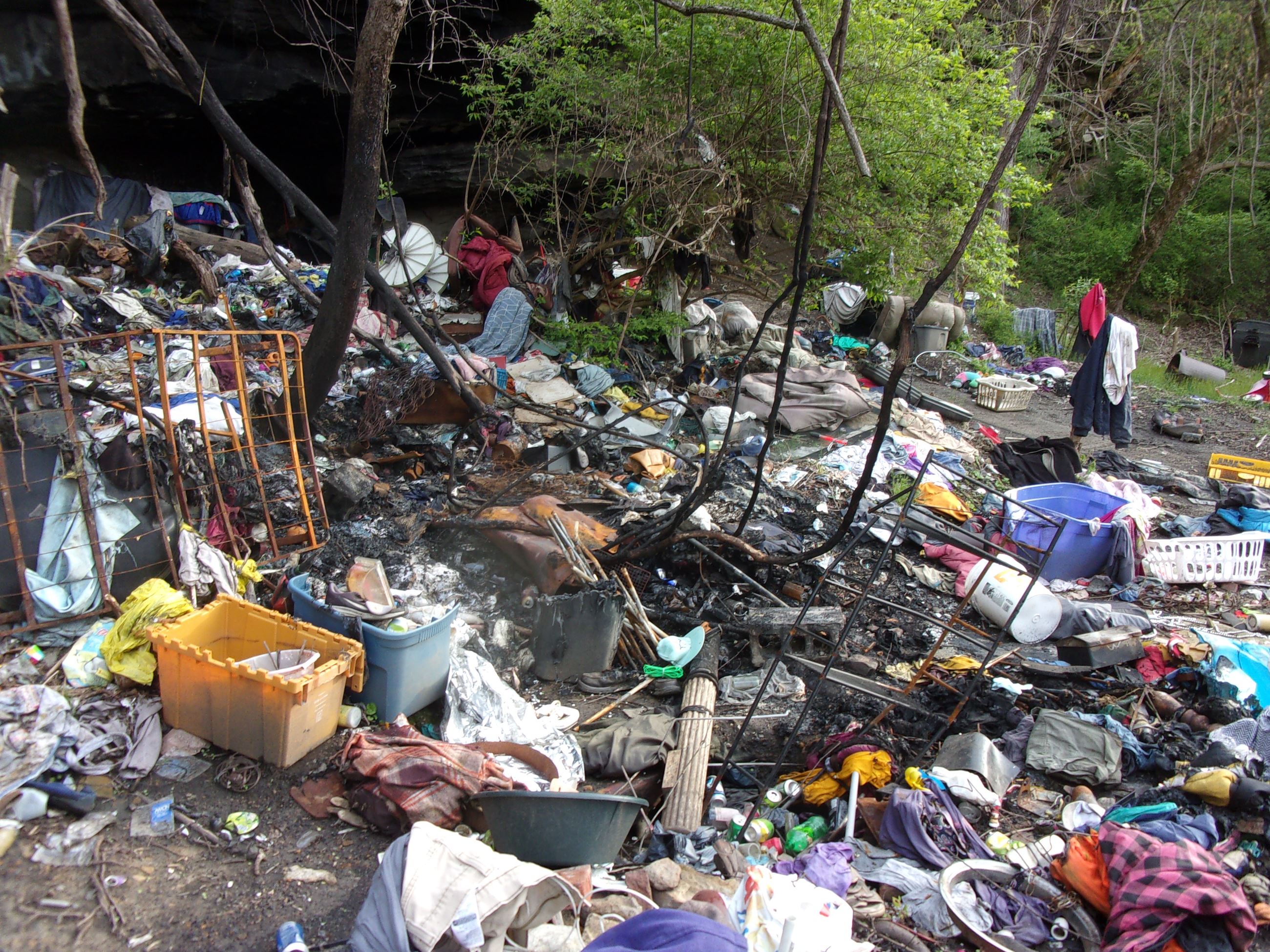 A closed portion of Washington Street, covered in refuse and litter.