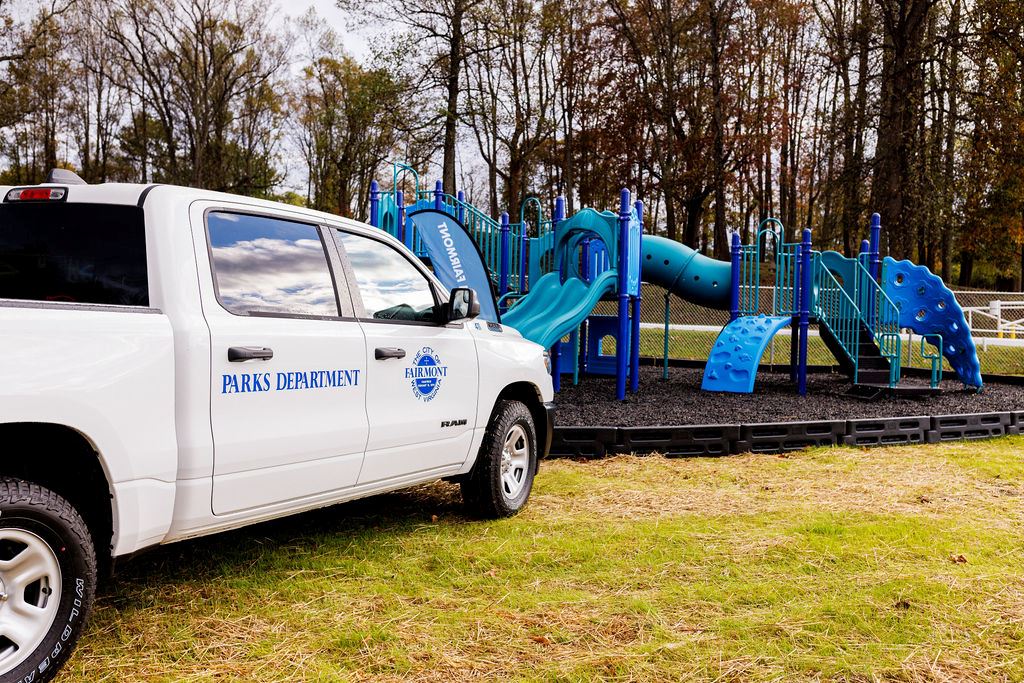 A photo of a truck branded with the City of Fairmont logo and the words, "Parks Department."